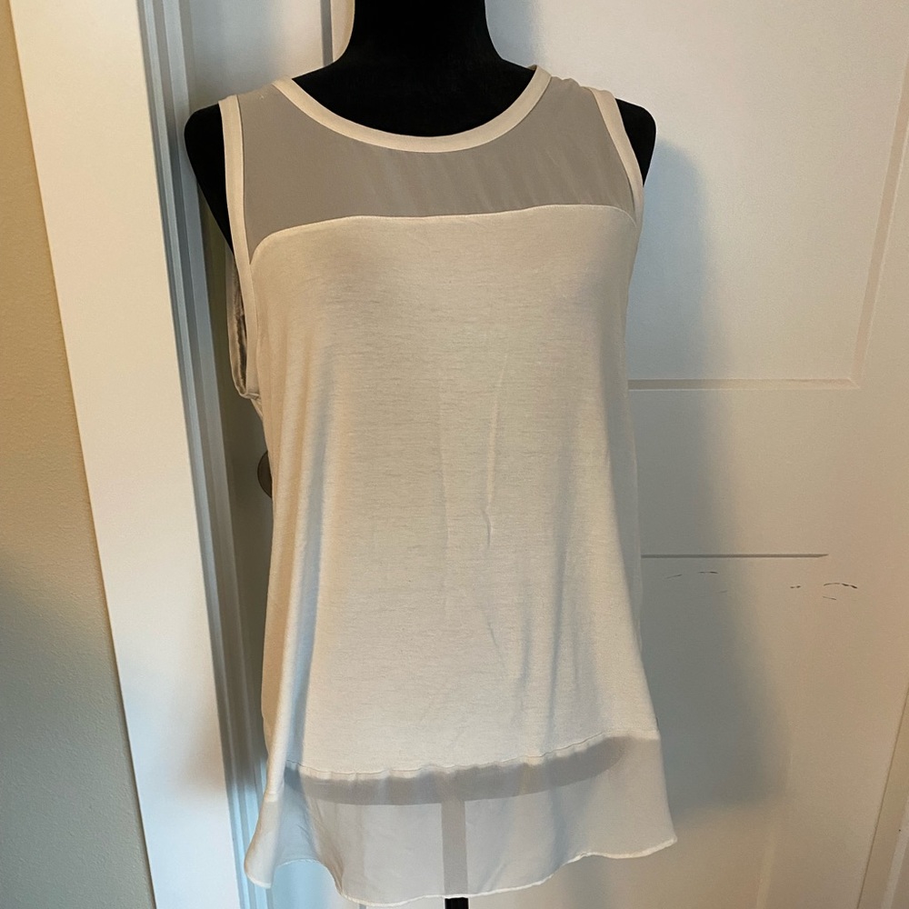 Sleeveless cream tunic in gently used condition